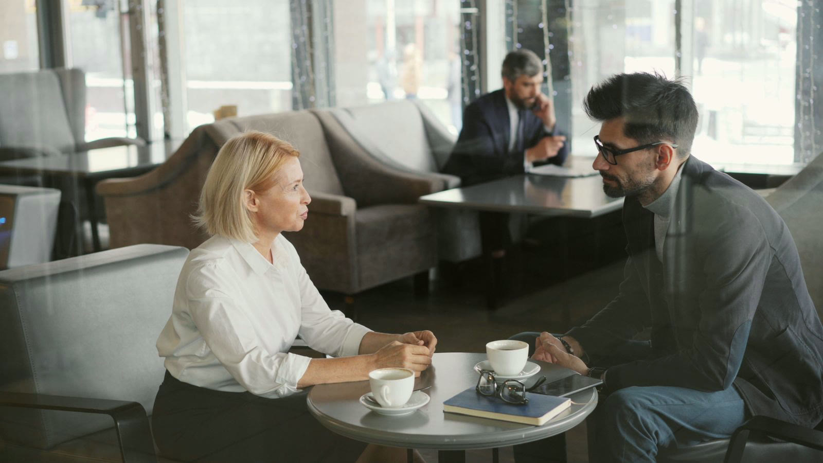 A caregiver in warm, attentive conversation with another person